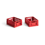 Two red mini storage crates with a perforated design, made from recycled plastic, displayed on a white background.