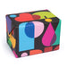 A wrapped gift box with colorful geometric patterned wrapping paper.