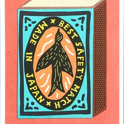 Matchbox with 'Made in Japan' and 'Best Safety Match' text on a pink background