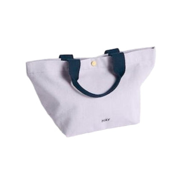 Lavender tote bag with black handles on a white background