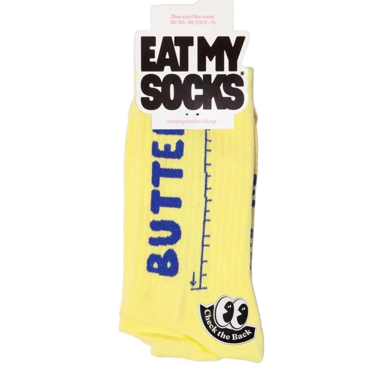 Yellow sock with 'Butter' text and 'Eat My Socks' packaging on a white background