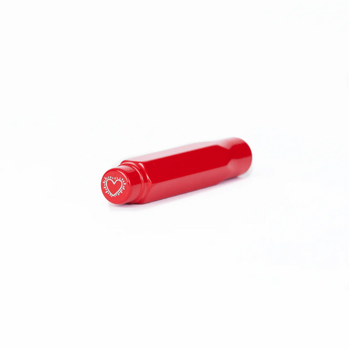 Red cylindrical object with a heart-shaped logo on a white background