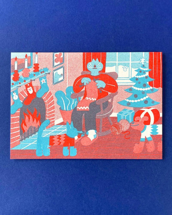 YUK FUN Christmas Card - Cozy Winter Indoor Knitting Scene