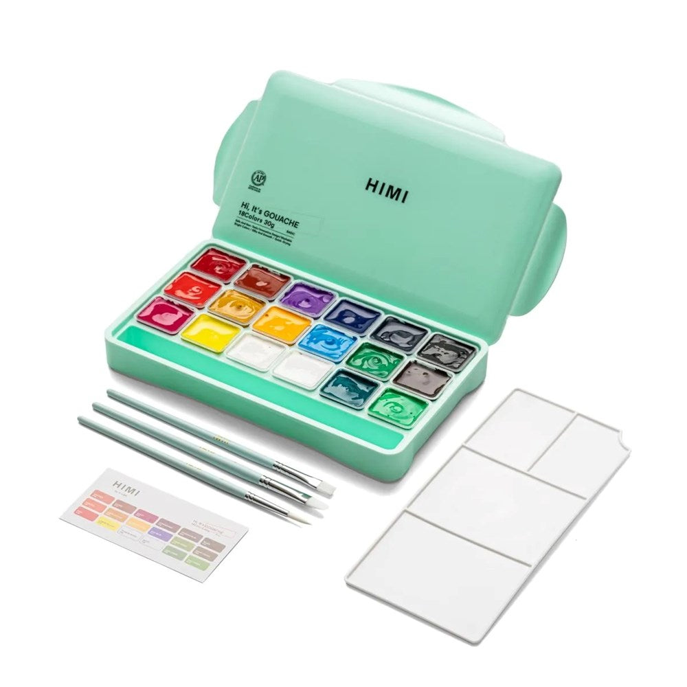 Green watercolor set with paint pans, brushes, and a color chart on a white background