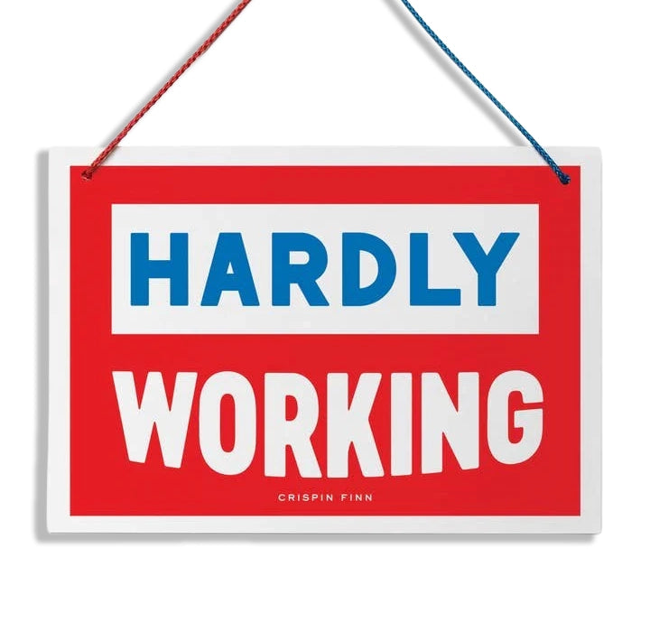 Red sign with blue and white text on a white background