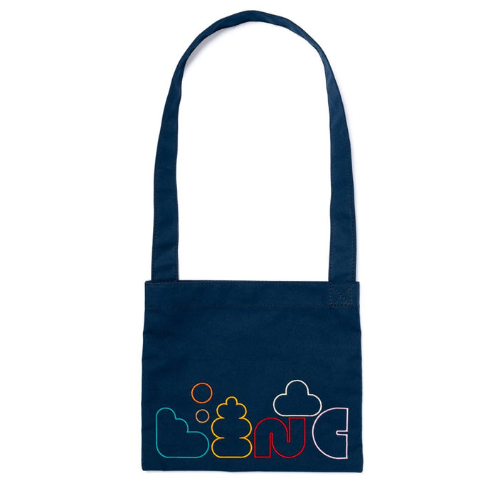 A navy blue cotton duck canvas crossbody musette bag with multicolored text and cloud embroidery on the front, set against a plain background.