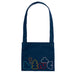 A navy blue cotton duck canvas crossbody musette bag with multicolored text and cloud embroidery on the front, set against a plain background.