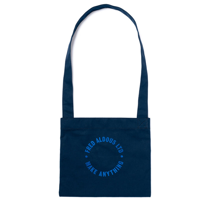 Navy blue tote bag with text on a white background