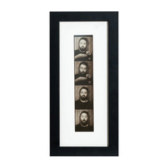 A black photobooth frame displaying a photo strip of multiple faces.