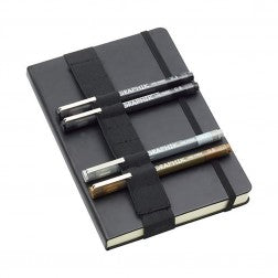 Image of the closed sketchbook with pens gripped underneath the wrap.